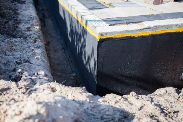 Professional Basement Waterproofing technician working in Paris, VA